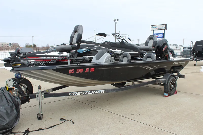 Slide: The Image of 2019 Crestliner VT 18 fishing boat on trailer, displayed outdoors. - 3