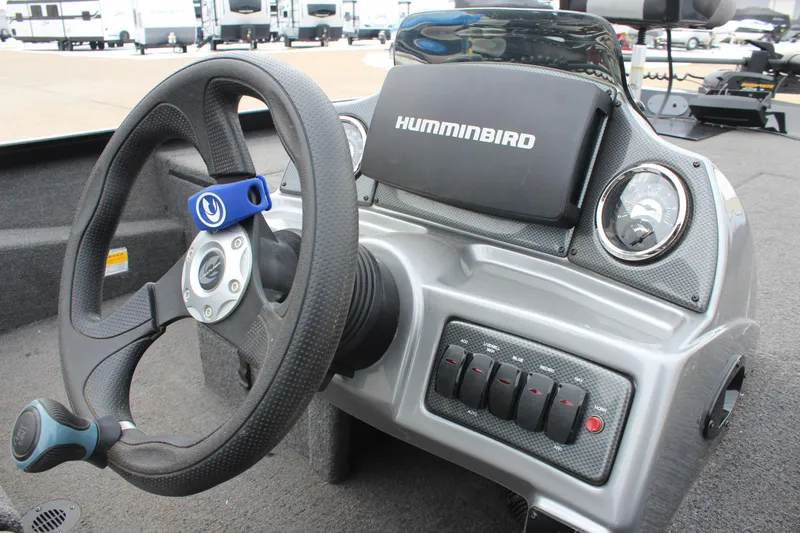 Slide: The Image of 2019 Crestliner VT 18 boat dashboard with steering wheel and Humminbird electronics. - 9
