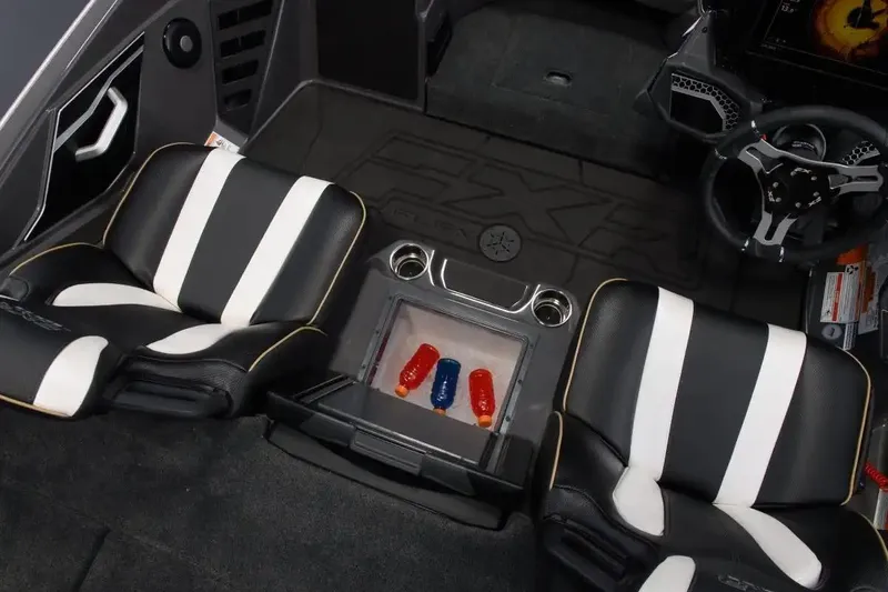 Slide: The Image of Manufacturer Provided Image: 2026 Skeeter FXR20 FLEX boat interior with black and white seats and steering wheel. - 16