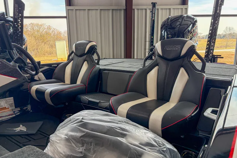 Slide: The Image of 2026 Skeeter FXR20 FLEX boat interior with dual black and white seats. - 5