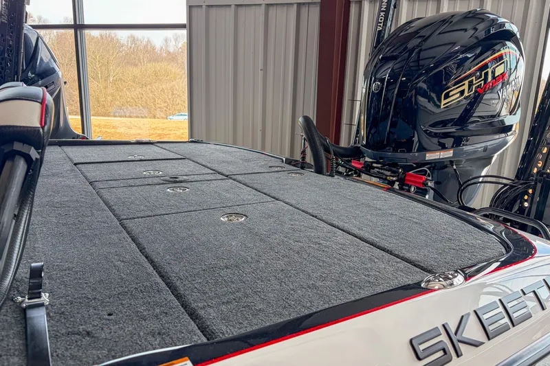 Slide: The Image of 2026 Skeeter FXR20 FLEX boat with Yamaha engine in a storage facility. - 7