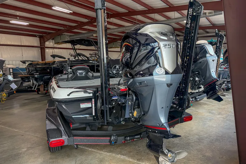 Slide: The Image of 2026 Skeeter FXR20 FLEX boat with powerful 350 engine in showroom. - 8