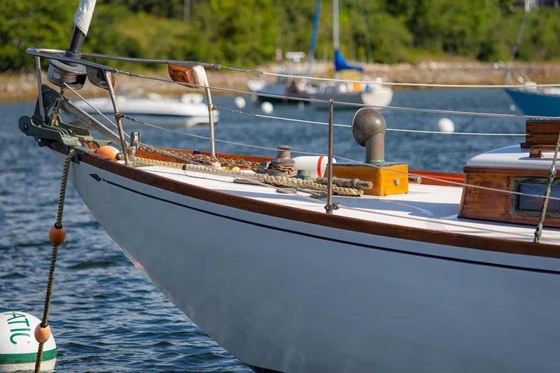 Slide: The Image of Classic 1957 Sparkman & Stephens K/CB Yawl sailboat docked on serene water. - 16