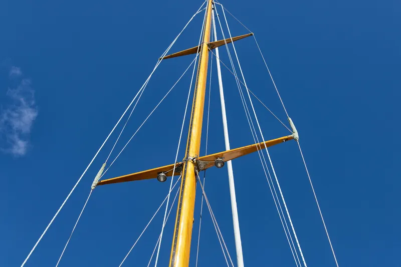 Slide: The Image of Mast of 1957 Sparkman & Stephens K/CB Yawl against clear blue sky. - 17