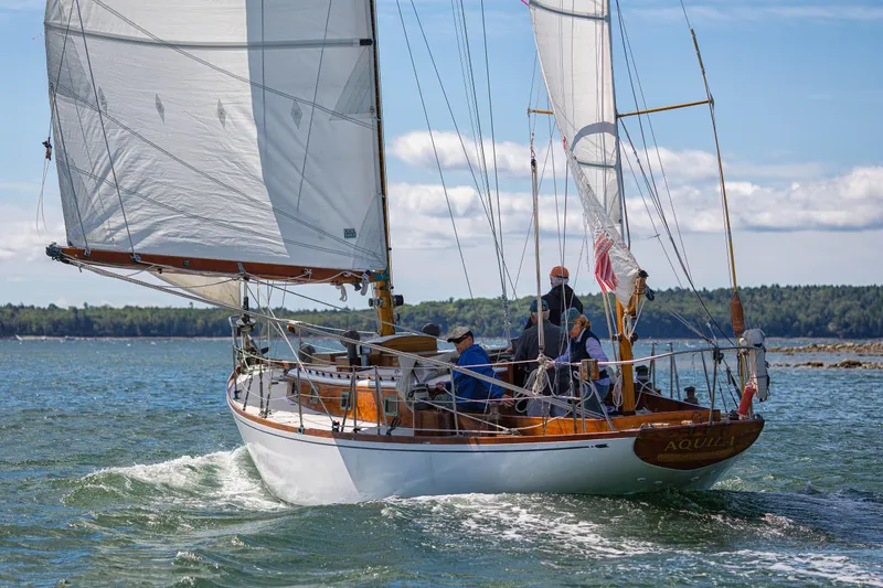 Slide: The Image of 1957 Sparkman & Stephens K/CB Yawl sailing on a sunny day with crew onboard. - 33