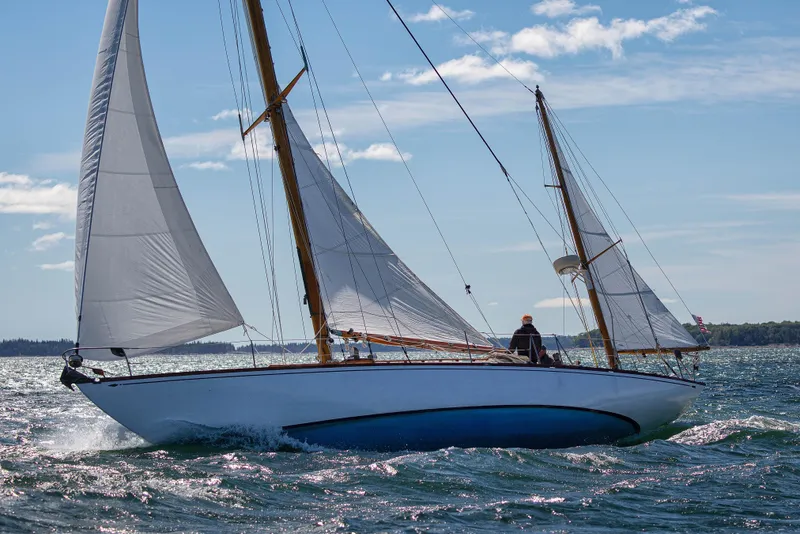Slide: The Image of 1957 Sparkman & Stephens K/CB Yawl sailing on a sunny day with full sails. - 41