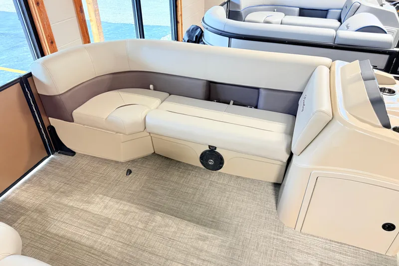 Slide: The Image of 2026 Bentley Pontoons LE 180CR interior with beige and brown seating. - 4