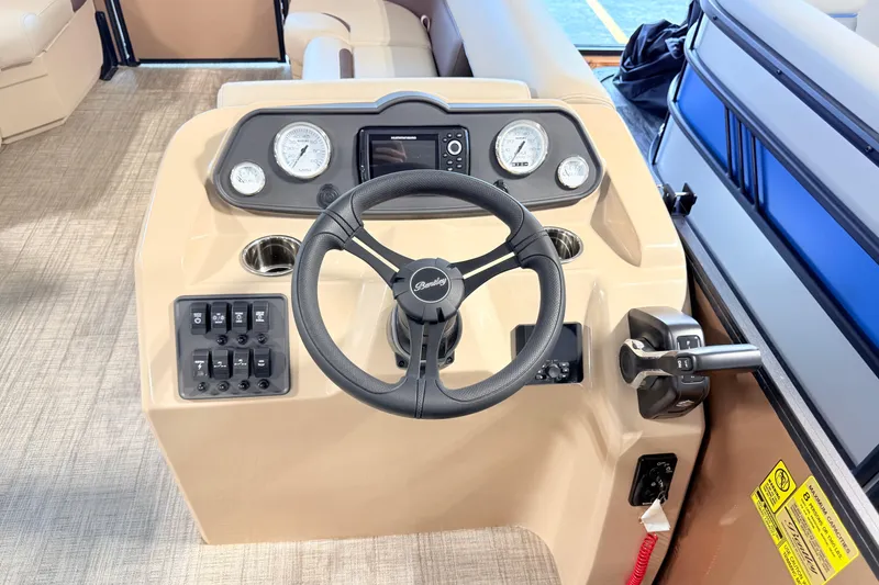 Slide: The Image of 2026 Bentley Pontoons LE 180CR helm with steering wheel and control panel. - 6