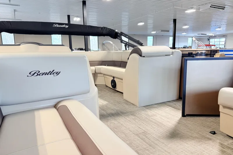 Slide: The Image of 2026 Bentley Pontoons LE 180CR interior with luxurious seating and modern design. - 8