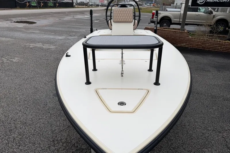 Slide: The Image of 2026 Chittum Skiffs 21 Laguna Madre boat, front view on pavement. - 10