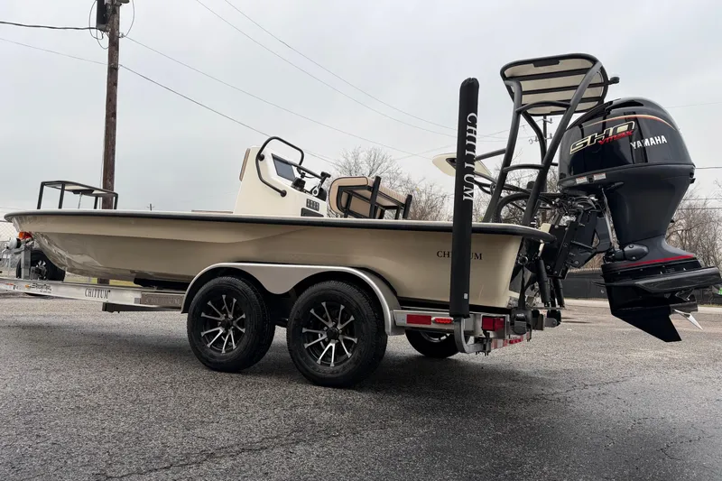 Slide: The Image of 2026 Chittum Skiffs 21 Laguna Madre boat on trailer with Yamaha engine. - 2
