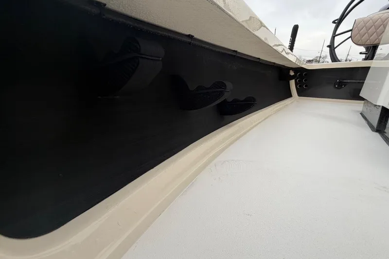 Slide: The Image of 2026 Chittum Skiffs 21 Laguna Madre interior view, showcasing sleek design and storage features. - 23
