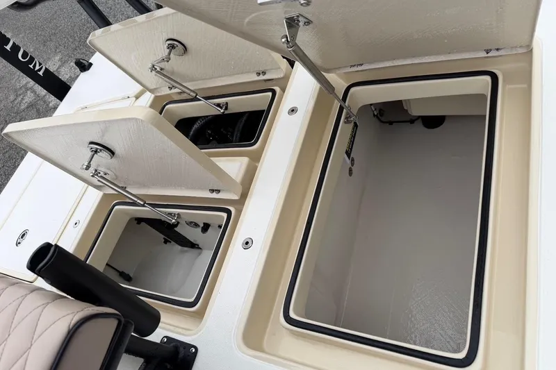 Slide: The Image of Open storage compartments on a 2026 Chittum Skiffs 21 Laguna Madre boat. - 24