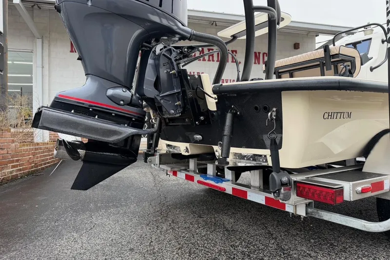 Slide: The Image of 2026 Chittum Skiffs 21 Laguna Madre boat on trailer, rear view with motor. - 8
