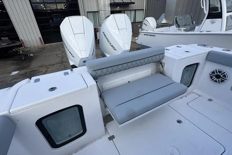 Slide: The Image of 2026 Sportsman Open 282 Center Console boat with dual Mercury engines and foldable seating. - 10