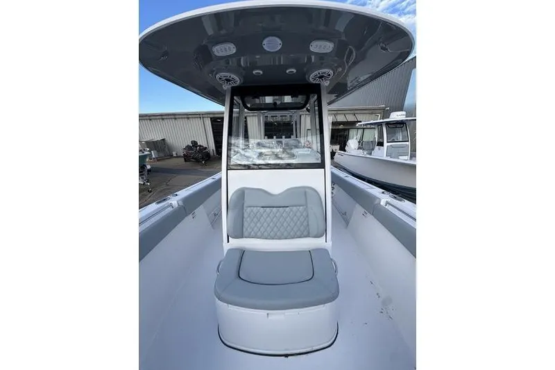 Slide: The Image of 2026 Sportsman Open 282 Center Console boat interior with seating and console view. - 12