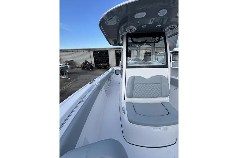 Slide: The Image of 2026 Sportsman Open 282 Center Console boat with sleek seating and modern design. - 16