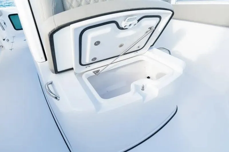 Slide: The Image of 2026 Sportsman Open 282 Center Console boat with open storage compartment. - 20