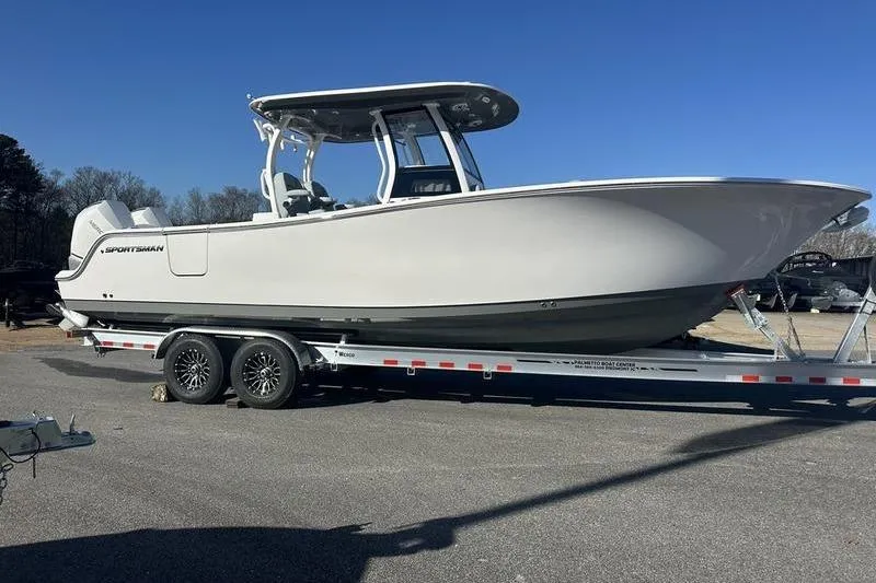 Slide: The Image of 2026 Sportsman Open 282 Center Console boat on trailer, parked outdoors. - 29