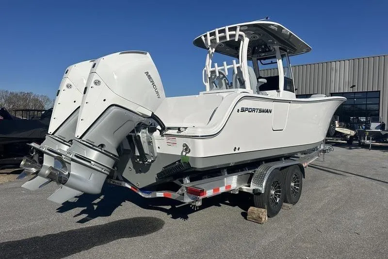 Slide: The Image of 2026 Sportsman Open 282 Center Console boat on trailer, dual Mercury engines. - 30