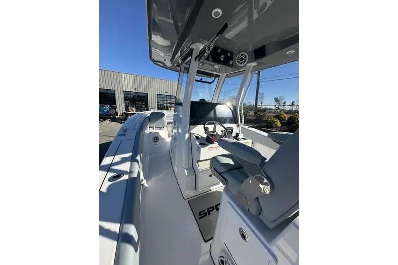 Slide: The Image of 2026 Sportsman Open 282 Center Console boat interior with modern helm and seating. - 34