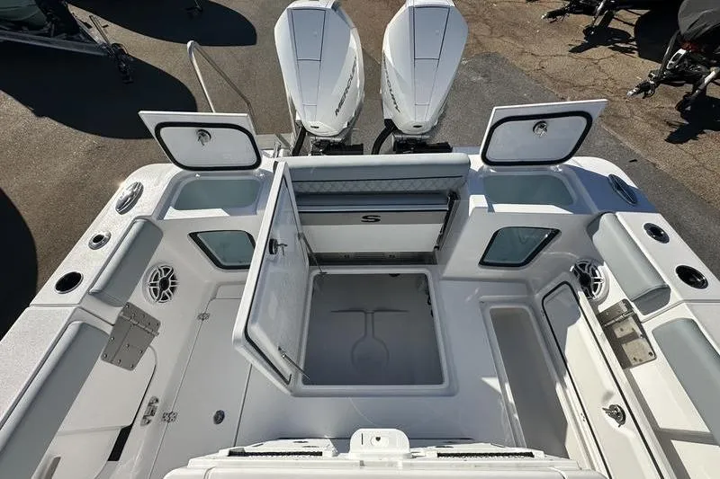 Slide: The Image of 2026 Sportsman Open 282 Center Console boat interior with storage compartments open. - 36