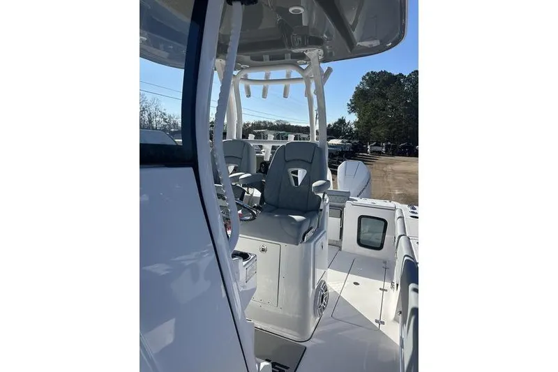 Slide: The Image of 2026 Sportsman Open 282 Center Console boat interior with seating and console view. - 39