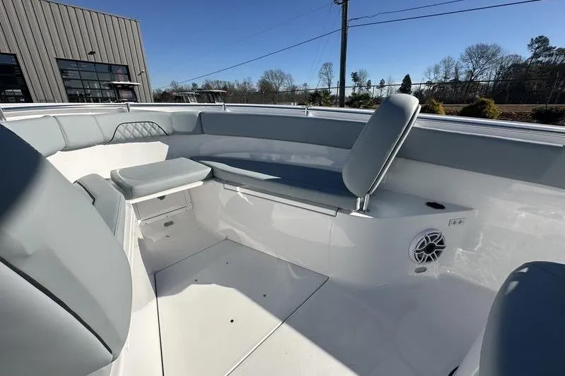 Slide: The Image of 2026 Sportsman Open 282 Center Console boat interior with gray seating and speaker. - 42