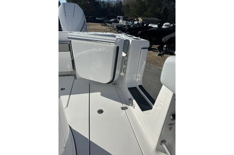 Slide: The Image of 2026 Sportsman Open 282 Center Console boat deck with storage compartment. - 43
