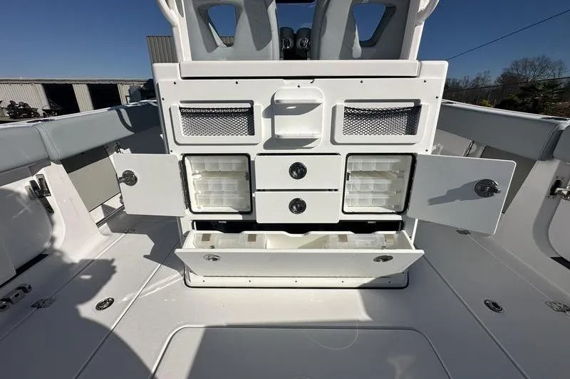 Slide: The Image of 2026 Sportsman Open 282 Center Console with open storage compartments and seating. - 44