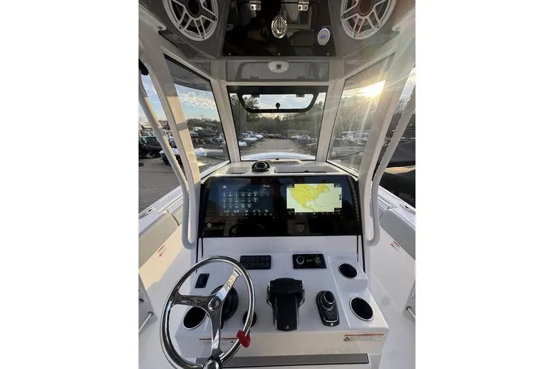 Slide: The Image of 2026 Sportsman Open 282 Center Console boat dashboard with modern navigation displays. - 6
