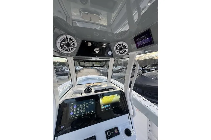 Slide: The Image of 2026 Sportsman Open 282 Center Console dashboard with advanced navigation and audio systems. - 8