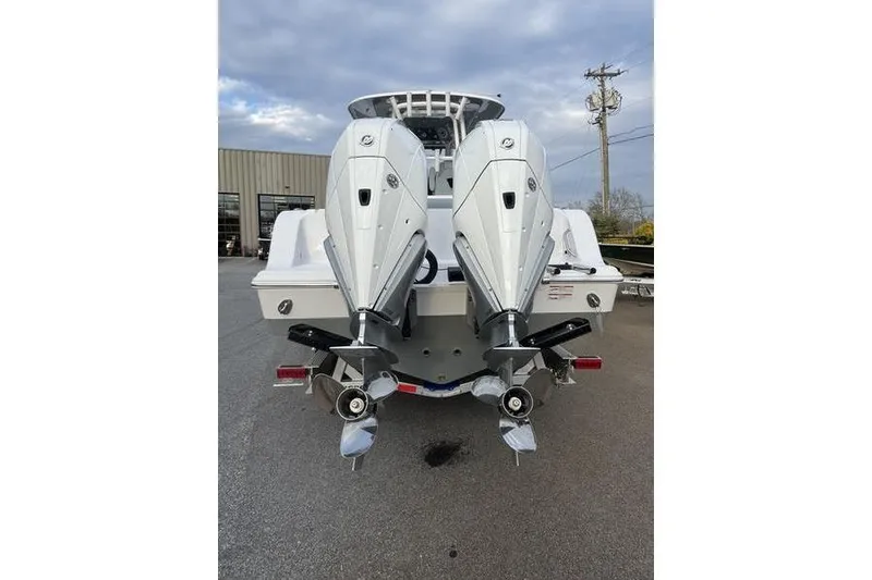 Slide: The Image of 2026 Sportsman Open 282 Center Console with dual outboard engines, rear view. - 9