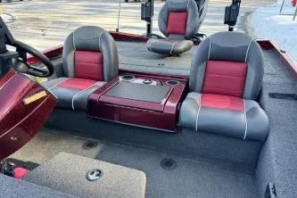Slide: The Image of 2018 Ranger RT198P boat interior with red and gray seating, cup holders, and console. - 5