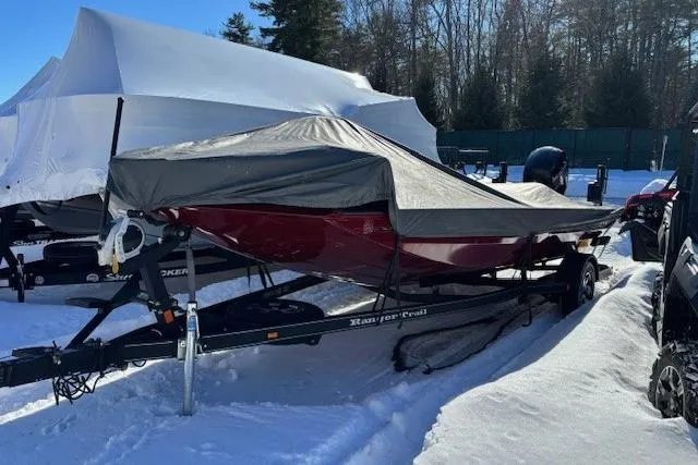 Slide: The Image of 2018 Ranger RT198P boat covered in snow, parked on a trailer outdoors. - 9