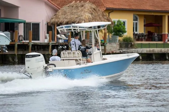 Slide: The Image of Manufacturer Provided Image: Sea Chaser 23 LX 2026 boat on water with palm trees in background. - 3