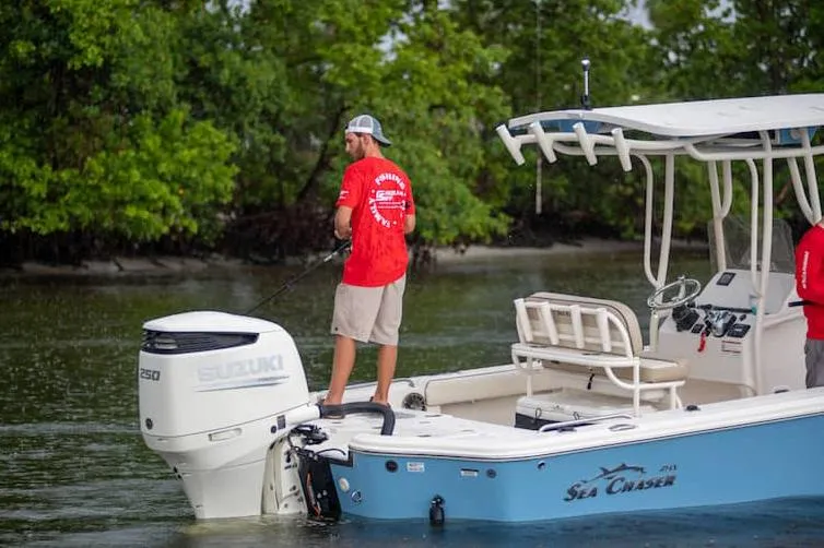 Slide: The Image of Manufacturer Provided Image: Sea Chaser 23 LX 2026 boat on water with two people. - 5