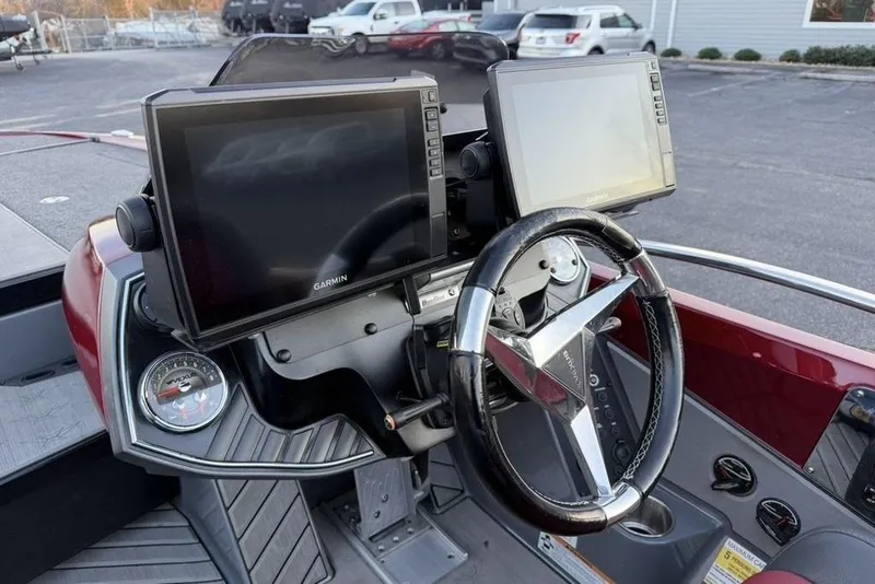 Slide: The Image of 2021 Vexus VX20 boat dashboard with Garmin displays and steering wheel. - 17