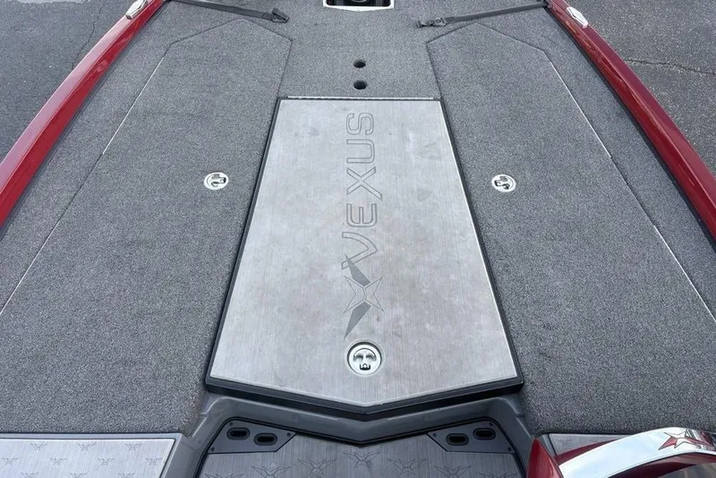 Slide: The Image of 2021 Vexus VX20 boat deck with gray carpeting and red accents. - 19