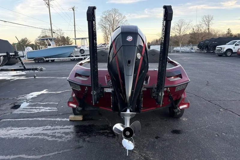 Slide: The Image of 2021 Vexus VX20 boat rear view with powerful outboard motor in a parking lot. - 2