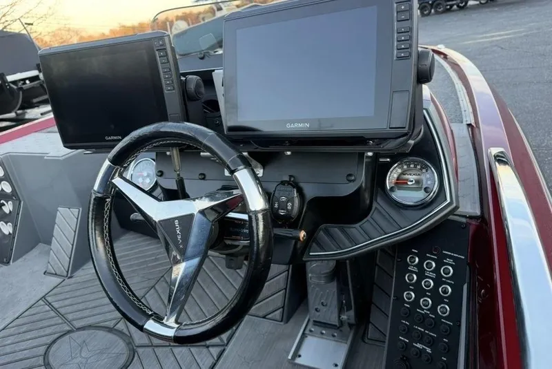 Slide: The Image of 2021 Vexus VX20 boat dashboard with Garmin displays and steering wheel. - 23