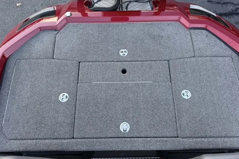 Slide: The Image of 2021 Vexus VX20 boat deck with red trim and storage compartments. - 25