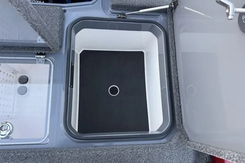 Slide: The Image of 2021 Vexus VX20 boat storage compartment with open lid, showcasing interior design. - 29