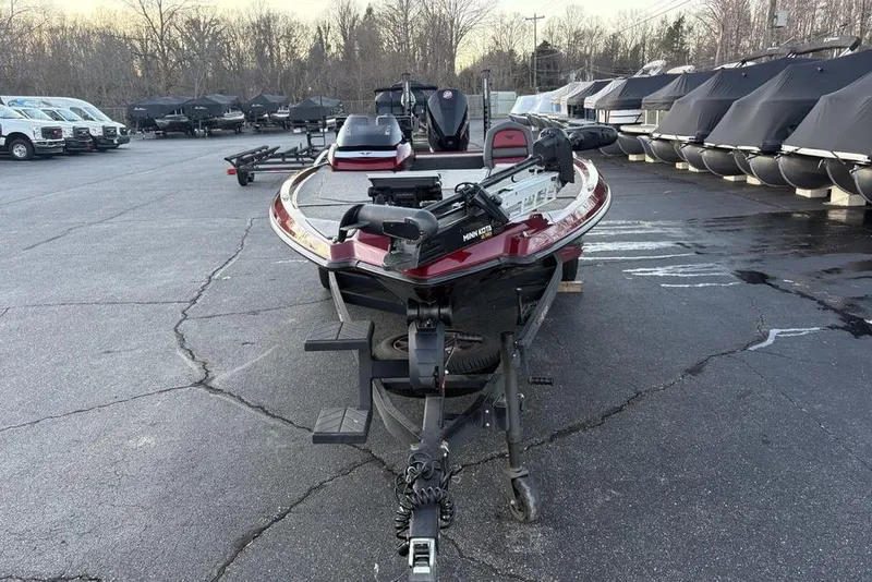 Slide: The Image of 2021 Vexus VX20 boat on trailer in parking lot, surrounded by covered boats. - 3