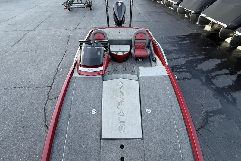 Slide: The Image of 2021 Vexus VX20 boat interior with red accents and spacious deck layout. - 30