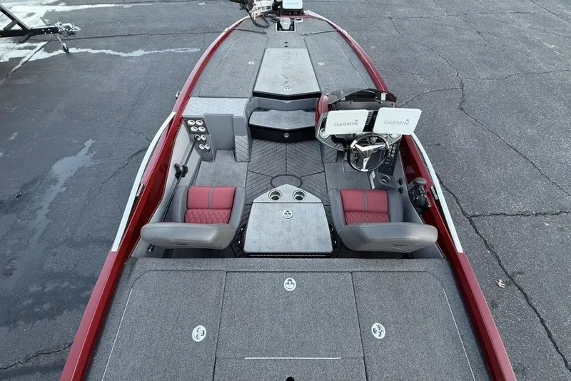 Slide: The Image of 2021 Vexus VX20 boat interior with dual Garmin displays and red-accented seating. - 31
