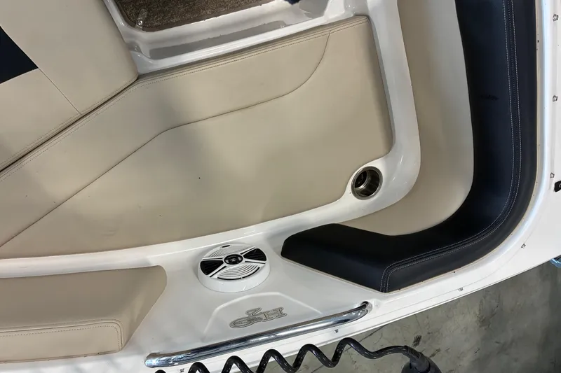 Slide: The Image of 2017 Chaparral 21 H2O Ski & Fish boat interior with speaker and seating. - 12
