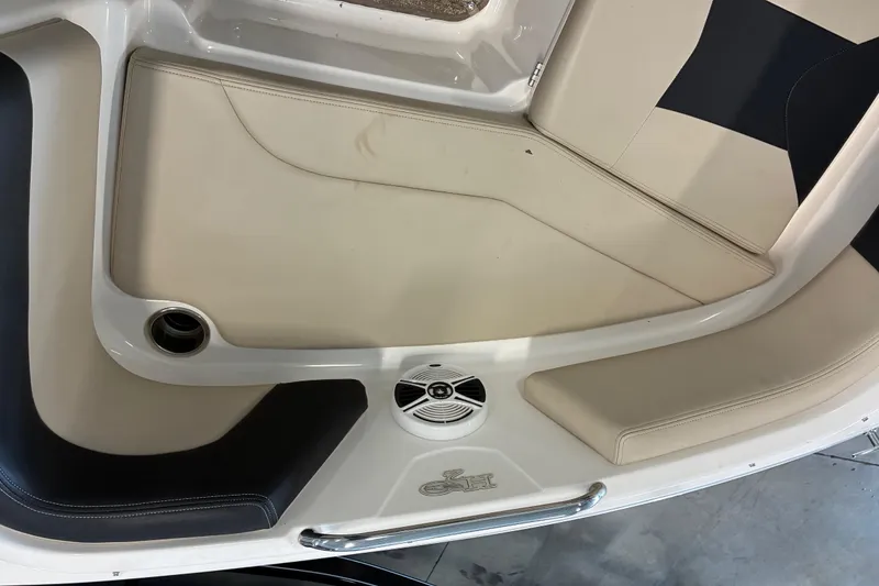 Slide: The Image of Interior seating of 2017 Chaparral 21 H2O Ski & Fish boat with speaker and cup holder. - 13