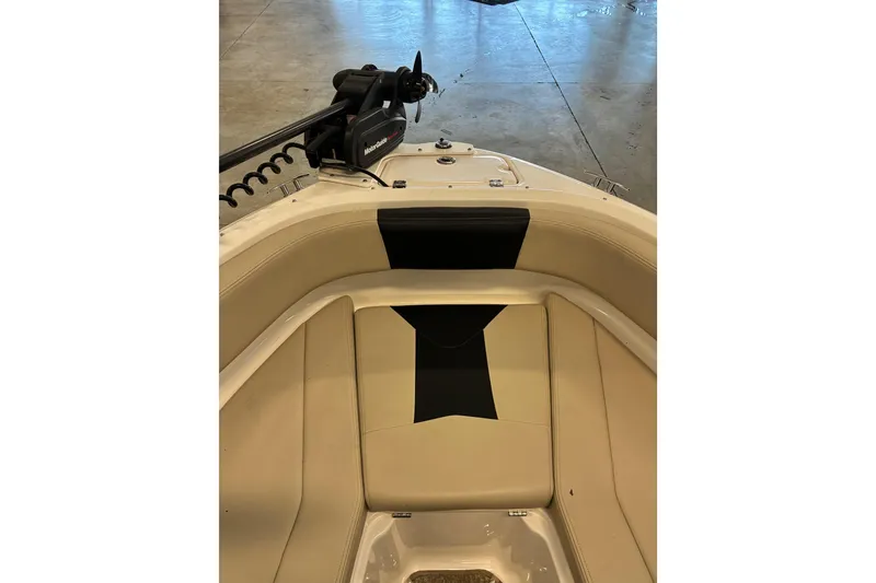 Slide: The Image of 2017 Chaparral 21 H2O Ski & Fish boat interior with seating and trolling motor. - 14