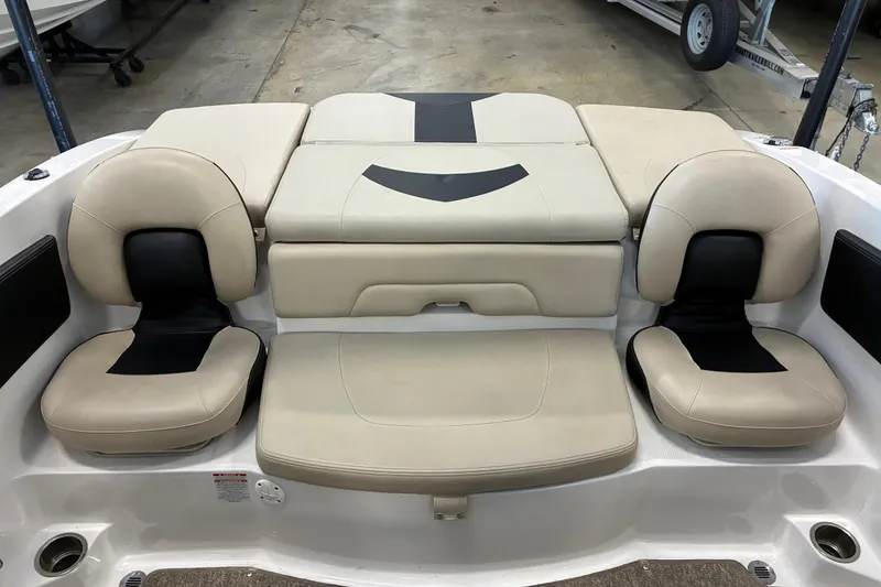 Slide: The Image of 2017 Chaparral 21 H2O Ski & Fish boat interior with beige and black seating. - 4